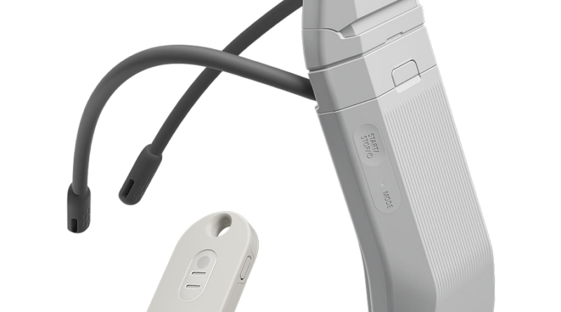 Behind-the-ear hearing aid with a curved silver body, slim tubing, and a small earbud at the end