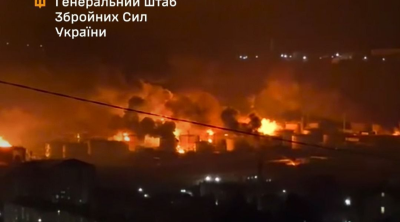 Nighttime scene of a battlefield with multiple fires burning across buildings, smoke rising and glow lighting the area; watermark reads 'General Staff of the Armed Forces of Ukraine' in Ukrainian.