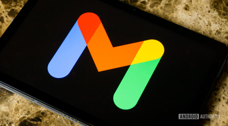Bright multicolor L-shaped logo on a tablet screen with blue, orange, yellow, and green arms