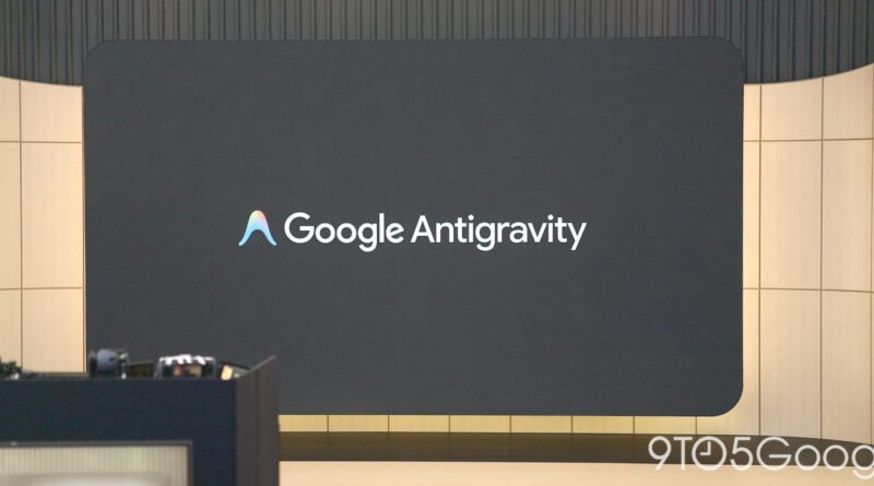 Large conference stage with a dark screen displaying the 'Google Antigravity' logo and rounded corners on the backdrop.
