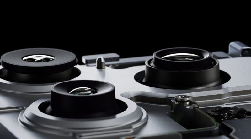 Close-up of a computer hard drive's internals, showing spinning metallic platters and read/write heads in a dark enclosure.