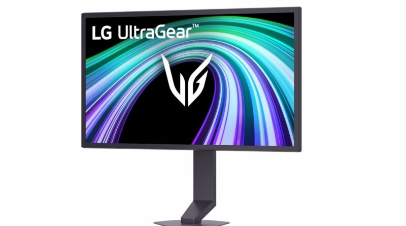 LG UltraGear gaming monitor on a stand displaying a vibrant swirling wallpaper with the LG logo.