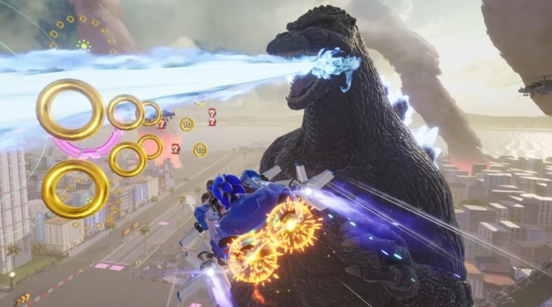 A giant kaiju fires a bright blue energy beam at a city skyline while a high-tech vehicle fires glowing projectiles nearby.