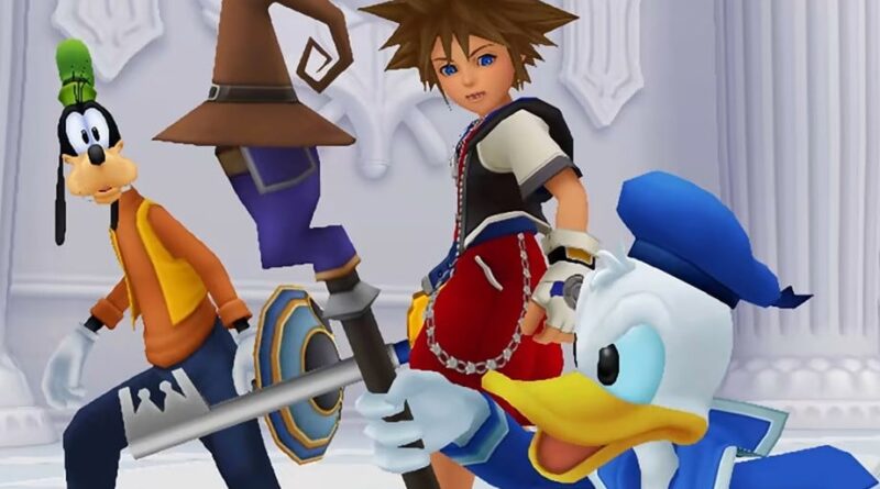 Sora holds a keyblade beside Goofy and Donald Duck in abright ornate hall background.