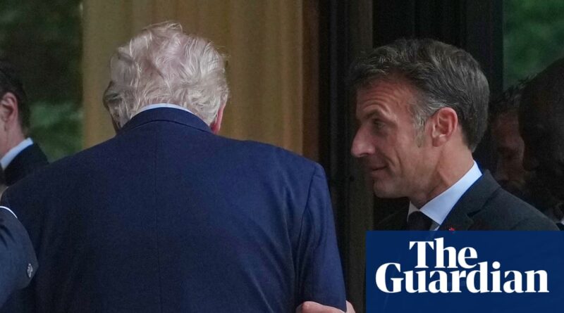 Two men in suits greet each other at a doorway, Guardian logo watermark in the corner, likely at a formal event.