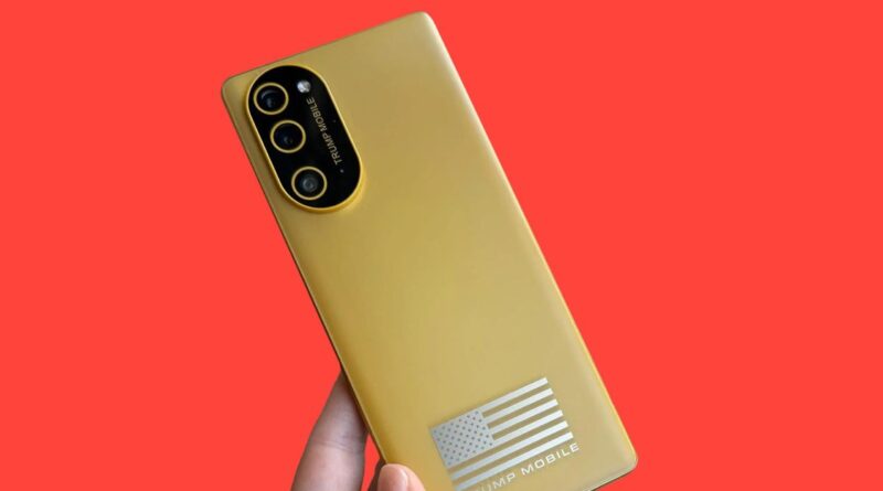 Gold smartphone with a tri-camera back held against a red background; features a silver American flag decal and 'TRUMP MOBILE' branding.