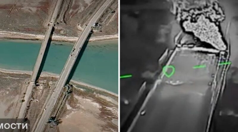 Aerial view of a bridge crossing a turquoise river.
