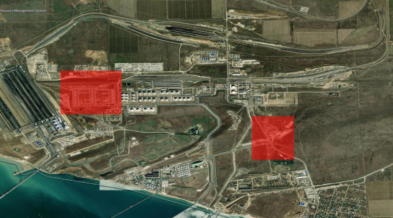 Satellite view of a coastal industrial complex with two red hotspot overlays indicating potential fires and activity at facilities.