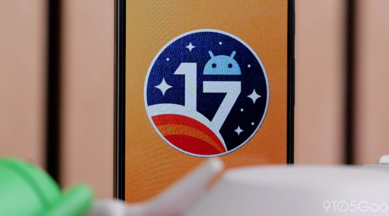 Smartphone screen showing the Android 17 badge in a blue circle with stars and a curved planet arc on an orange background.