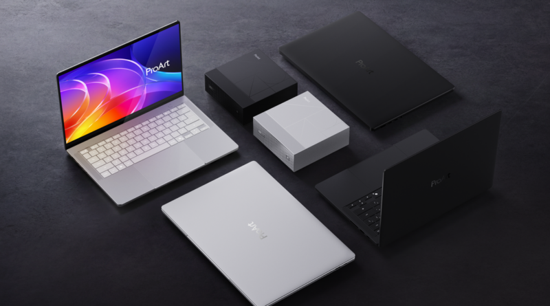 Group of ProArt laptops and boxed accessories arranged on a dark surface, showcasing the product lineup in silver, black, and gray finishes.