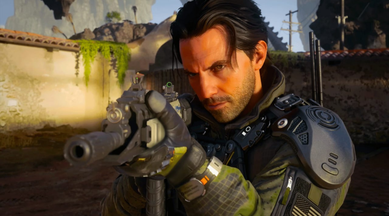 Male soldier in tactical armor aims a rifle in a dusty outdoor setting.