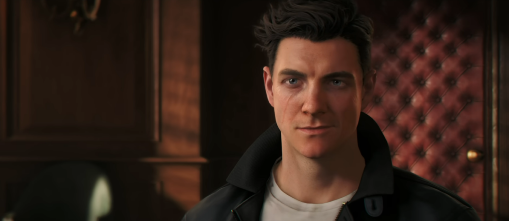 Man with dark hair in a black leather jacket gazes ahead in a warm, wood-paneled room with tufted red leather wall behind him.