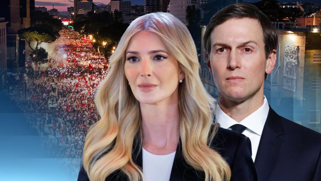 Two well-dressed adults, a man and a woman, stand in the foreground with a large urban crowd at a nighttime rally behind them.