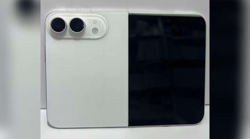 Close-up of a white foldable device showing dual rear cameras on the left and a black display panel on the right.
