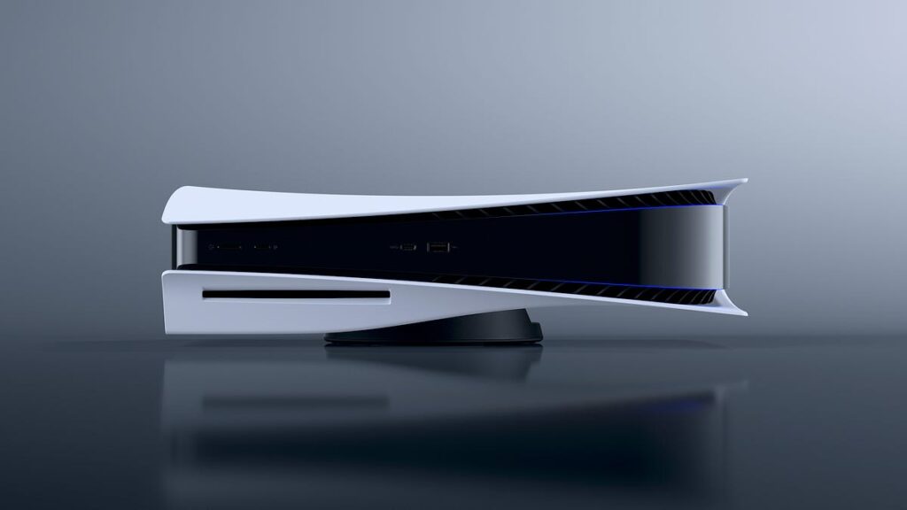 Side view of a futuristic white gaming console on a stand, with a slim black center and blue accent lighting visible on the top edge/vent area.